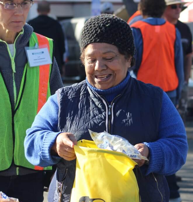 Happy woman receiving food